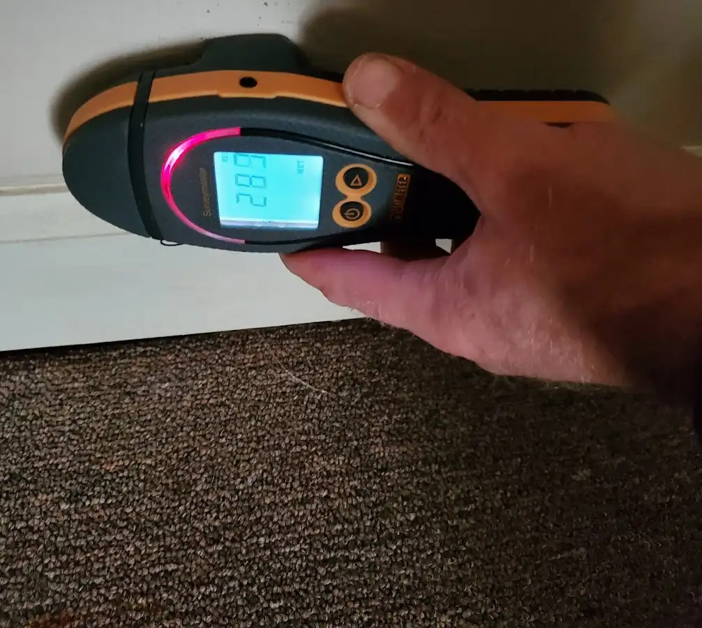 Moisture detection at baseboard during Storm Damage Restoration in Spring Garden
